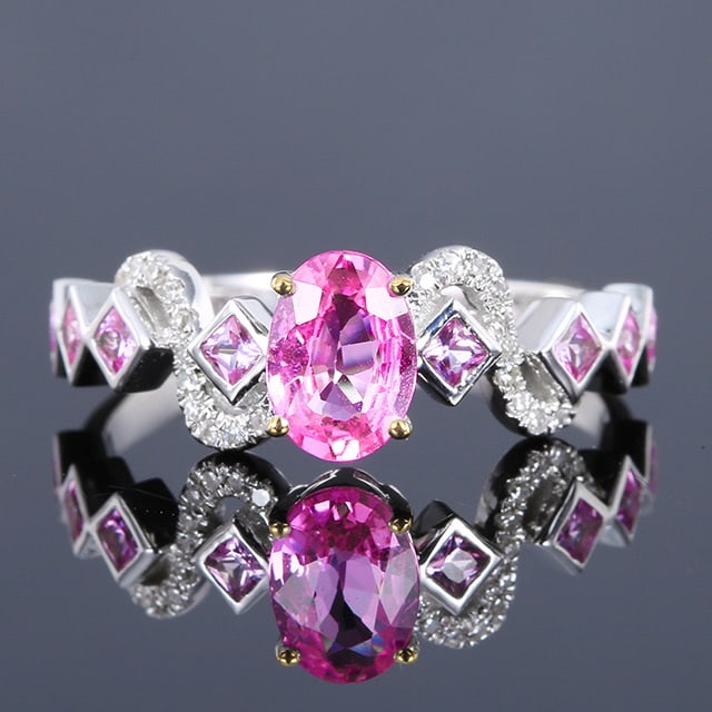 14k Gold 1.07 Ctw Natural Padparadscha Sapphire & Sapphire Ring: Ref:230984050 // gold content:14k gold // ring size:7. 25us // // main gemstone:padparadscha sapphire // shape:oval // carat weight:0. 78ct // color:orangish pink // treatment:natural // // adjacent