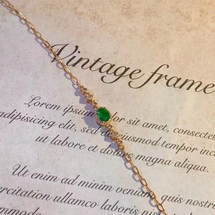 14k Gold 0.45 Ct Vivid Green Natural Emerald & Diamond Bracelet: Ref:230984110 // gold content:14k gold // main gemstone:emerald // shape:oval // carat weight:0. 45ct // color:vivid green // treatment:natural // // adjacent gemstone 2 : diamond // number of