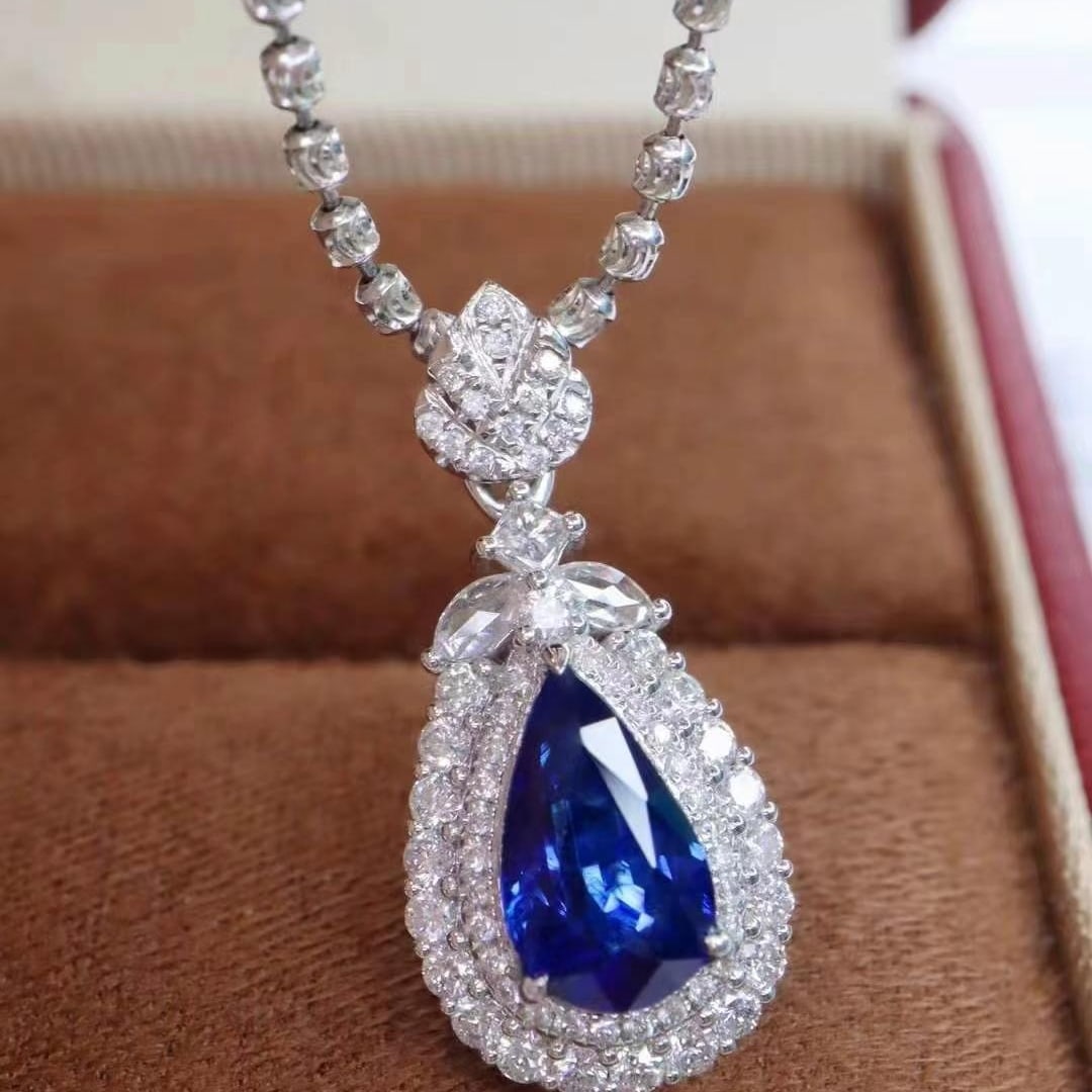 14k Gold 2.14 Ctw Natural Sapphire & Diamond Pendant( Without Chain ): Ref:230984117 // gold content:14k gold // main gemstone:sapphire // shape:pear // carat weight:1. 59ct // color:royal blue // treatment:natural // // adjacent gemstone 2 : diamond // shape:multiply //