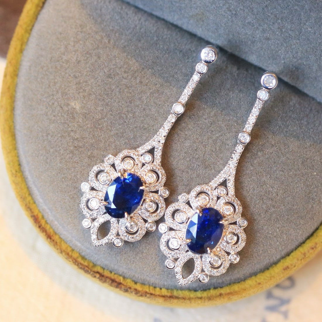 14k Gold 2.76 Ctw Natural Sapphire & Diamond Earrings: Ref:230984132 // gold content:14k gold // main gemstone:sapphire // shape:oval // carat weight:2. 03ct // color:blue // treatment:natural // // adjacent gemstone 2 : diamond // shape:round // carat we