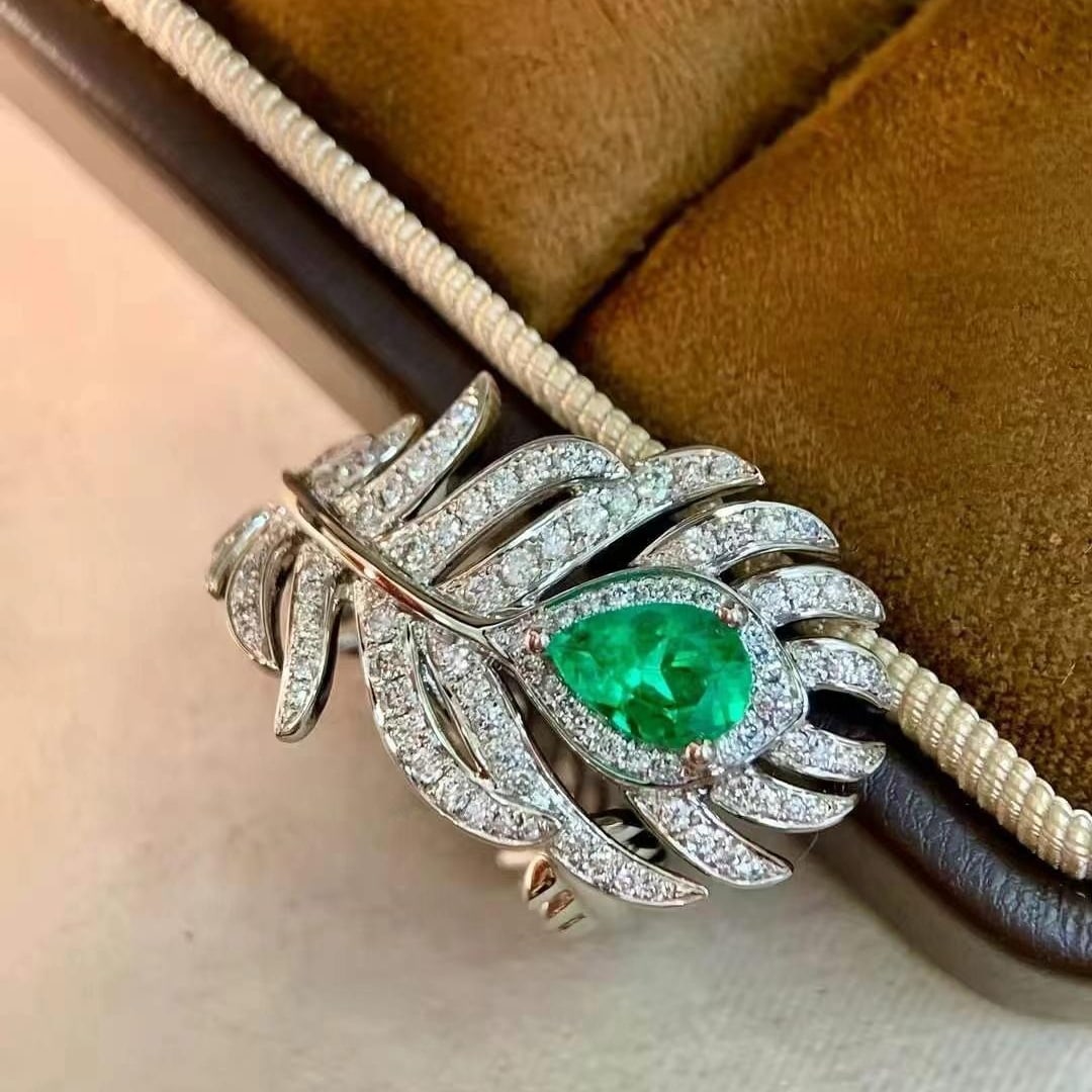 14k Gold 0.96 Ctw Vivid Green Natural Emerald & Diamond Ring: Ref:230984186 // gold content:14k gold // ring size:7. 25us // // main gemstone:emerald // shape:pear // carat weight:0. 58ct // color:vivid green // treatment:natural // // adjacent gemstone 2 :