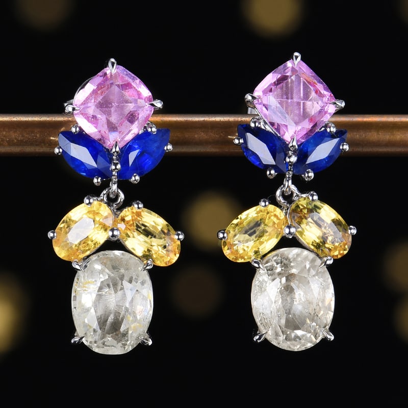 14k Gold 6.85 Ct Natural Sapphire Earrings: Ref:230984187 // gold content:14k gold // main gemstone:sapphire // shape:multiply // carat weight:6. 85ct // color:color // treatment:natural // Condition: New Low Estimate: 7700 High Estimate: 12000