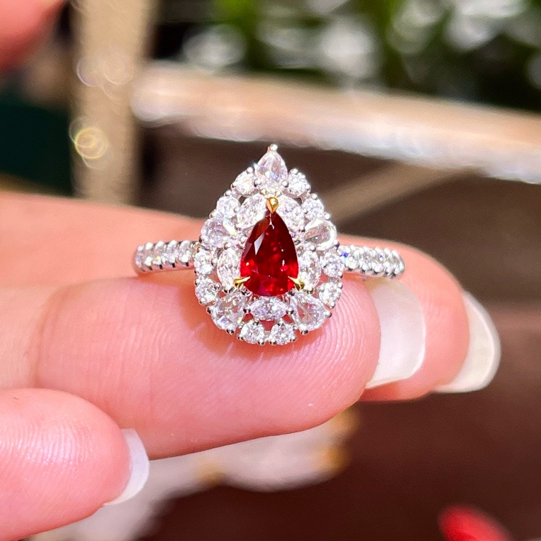 14k Gold 1.09 Ctw Natural Ruby & Diamond Ring: Ref:230984204 // gold content:14k gold // ring size:7. 25us // // main gemstone:ruby // shape:pear // carat weight:0. 53ct // color:pigeonblood red // treatment:natural // // adjacent gemstone 2 : dia
