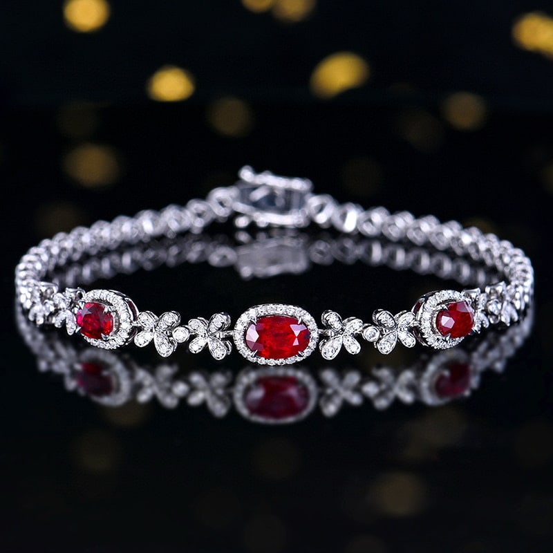 14k Gold 1.76 Ctw Natural Ruby & Diamond Bracelet: Ref:230984231 // gold content:14k gold // main gemstone:ruby // shape:oval // carat weight:1. 4ct // color:pigeonblood red // treatment:natural // // adjacent gemstone 2 : diamond // number of