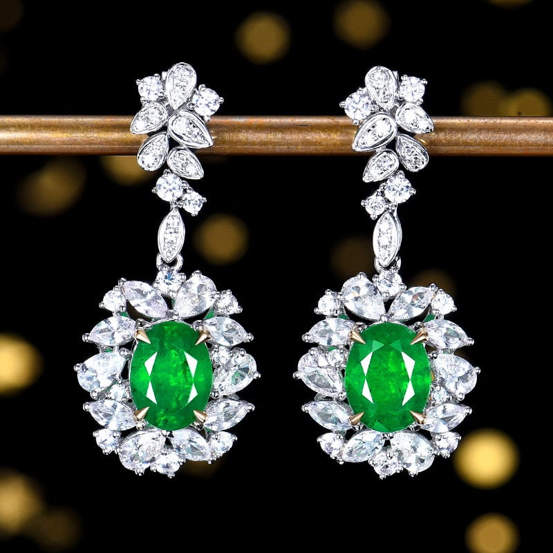 14k Gold 5.23 Ctw Vivid Green Natural Emerald & Sapphire Earrings: Ref:230984362 // gold content:14k gold // main gemstone:emerald // shape:oval // carat weight:2. 52ct // color:vivid green // treatment:natural // // adjacent gemstone 2 : sapphire // number of stones