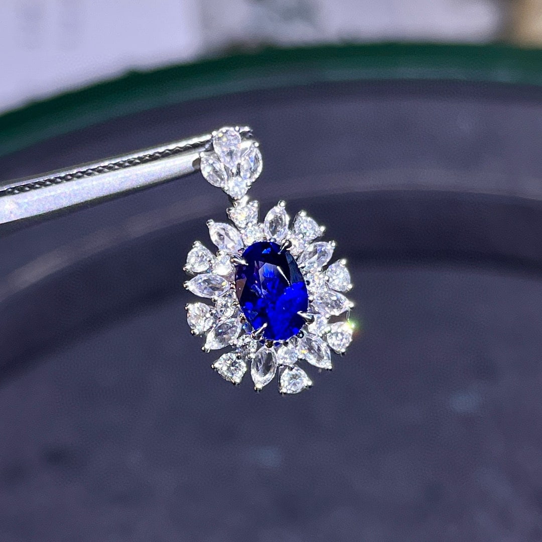 14k Gold 2.27 Ctw Natural Sapphire & Diamond Pendant( Without Chain ): Ref:230984373 // gold content:14k gold // main gemstone:sapphire // shape:oval // carat weight:1. 5ct // color:blue // treatment:natural // // adjacent gemstone 2 : diamond // number of stones:28 // s