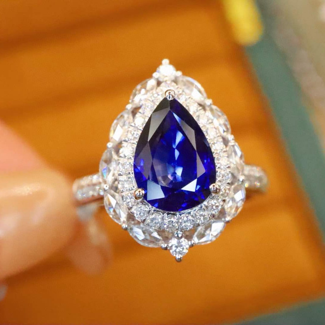 14k Gold 2.80 Ctw Natural Sapphire & Diamond Ring: Ref:230984374 // gold content:14k gold // ring size:7. 25us // // main gemstone:sapphire // shape:pear // carat weight:2. 31ct // color:royal blue // treatment:natural // // adjacent gemstone 2 : diam