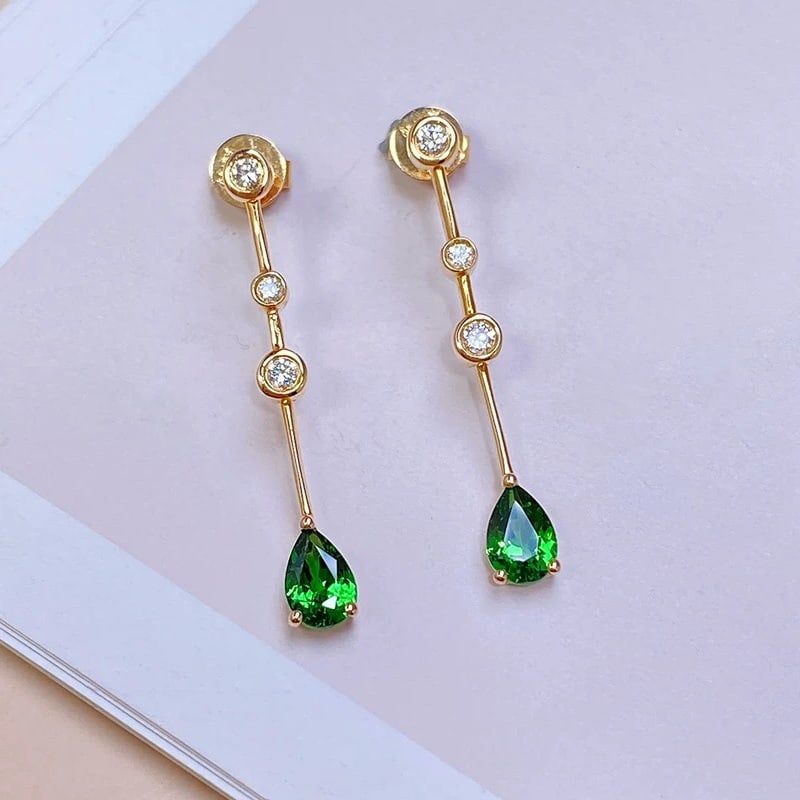 14k Gold 0.98 Ctw Natural Tsavorite & Diamond Earrings: Ref:230985019 // gold content:14k gold // main gemstone:tsavorite // shape:pear // carat weight:0. 84ct // color:green // treatment:natural // // adjacent gemstone 2 : diamond // shape:round // carat