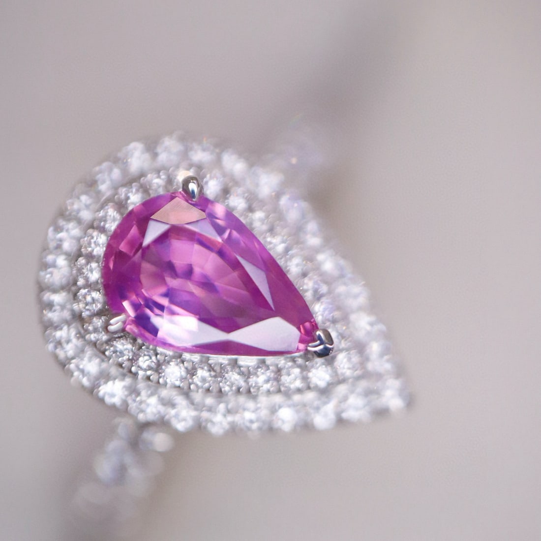 14k Gold 1.20 Ctw Natural Padparadscha Sapphire & Diamond Ring: Ref:230985093 // gold content:14k gold // ring size:7. 25us // // main gemstone:padparadscha sapphire // shape:pear // carat weight:0. 86ct // color:pink // treatment:natural // // adjacent gemstone