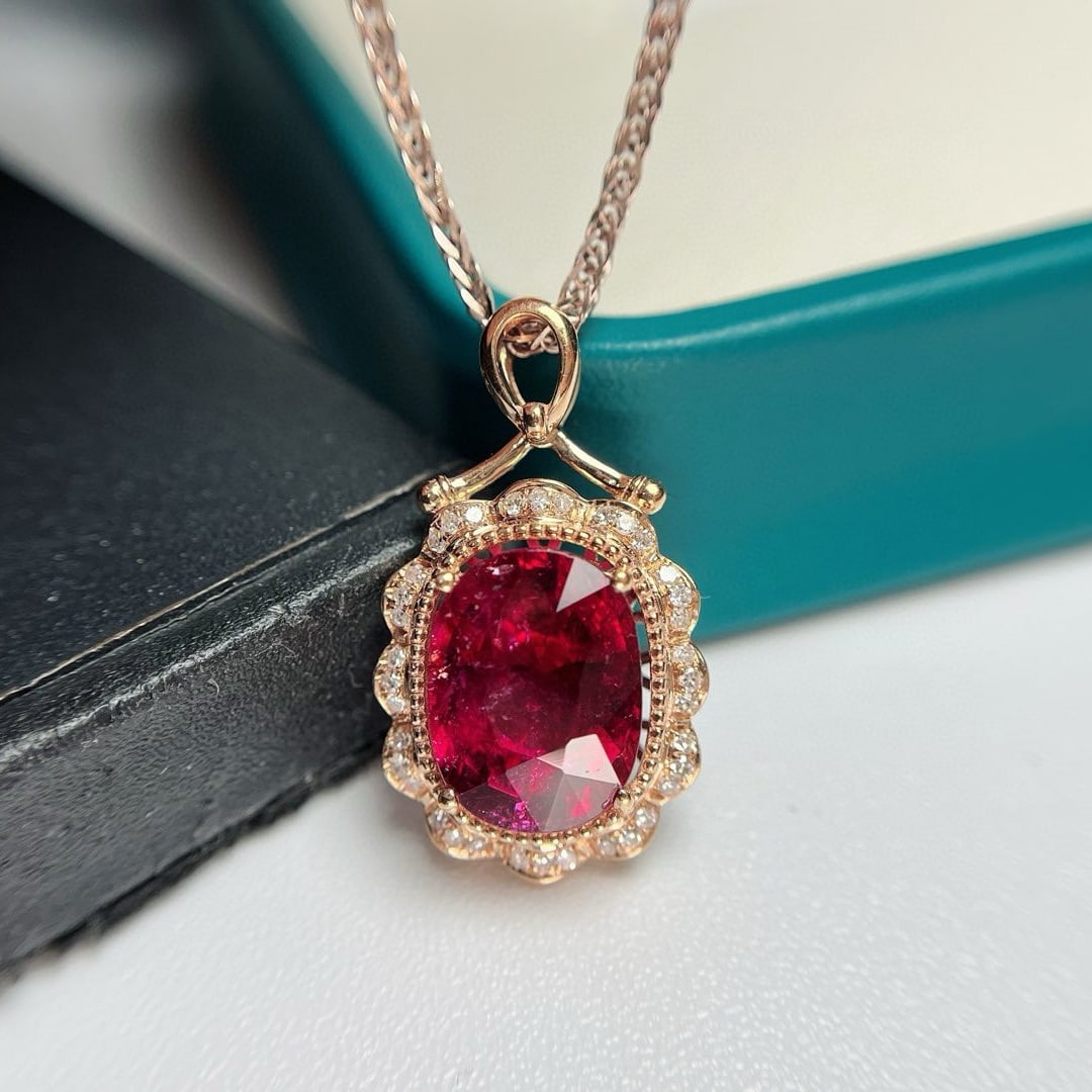 14k Gold 3.9 Ct Natural Tourmaline & Diamond Pendant( Without Chain ): Ref:230985123 // gold content:14k gold // main gemstone:tourmaline // shape:oval // carat weight:3. 9ct // color:red // treatment:natural // // adjacent gemstone 2 : diamond // number of stones:36 //