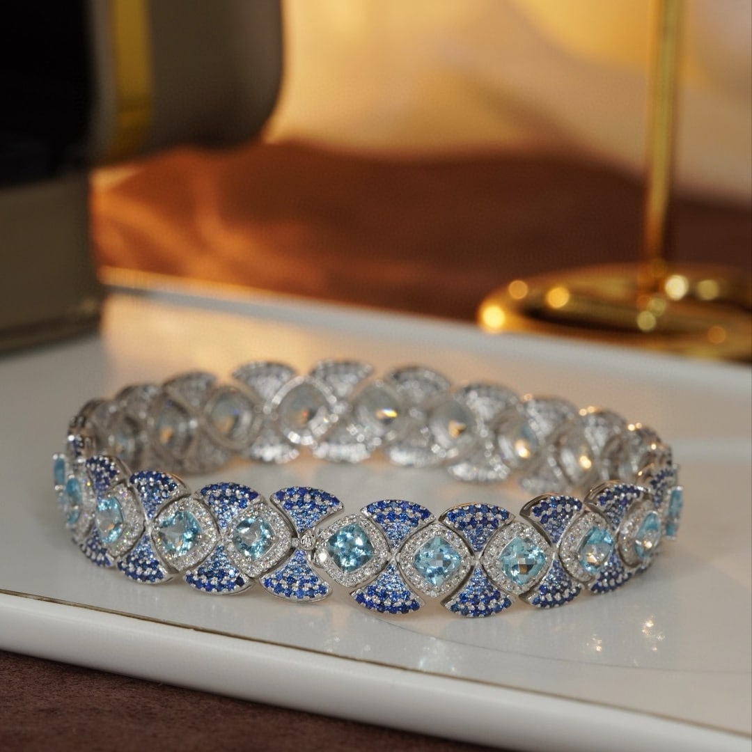 14k Gold 9.6 Ctw Natural Aquamarine & Sapphire Bracelet: Ref:230985132 // gold content:14k gold // main gemstone:aquamarine // shape:cushion // carat weight:6. 2ct // color:blue // treatment:natural // // adjacent gemstone 2 : sapphire // shape:round //