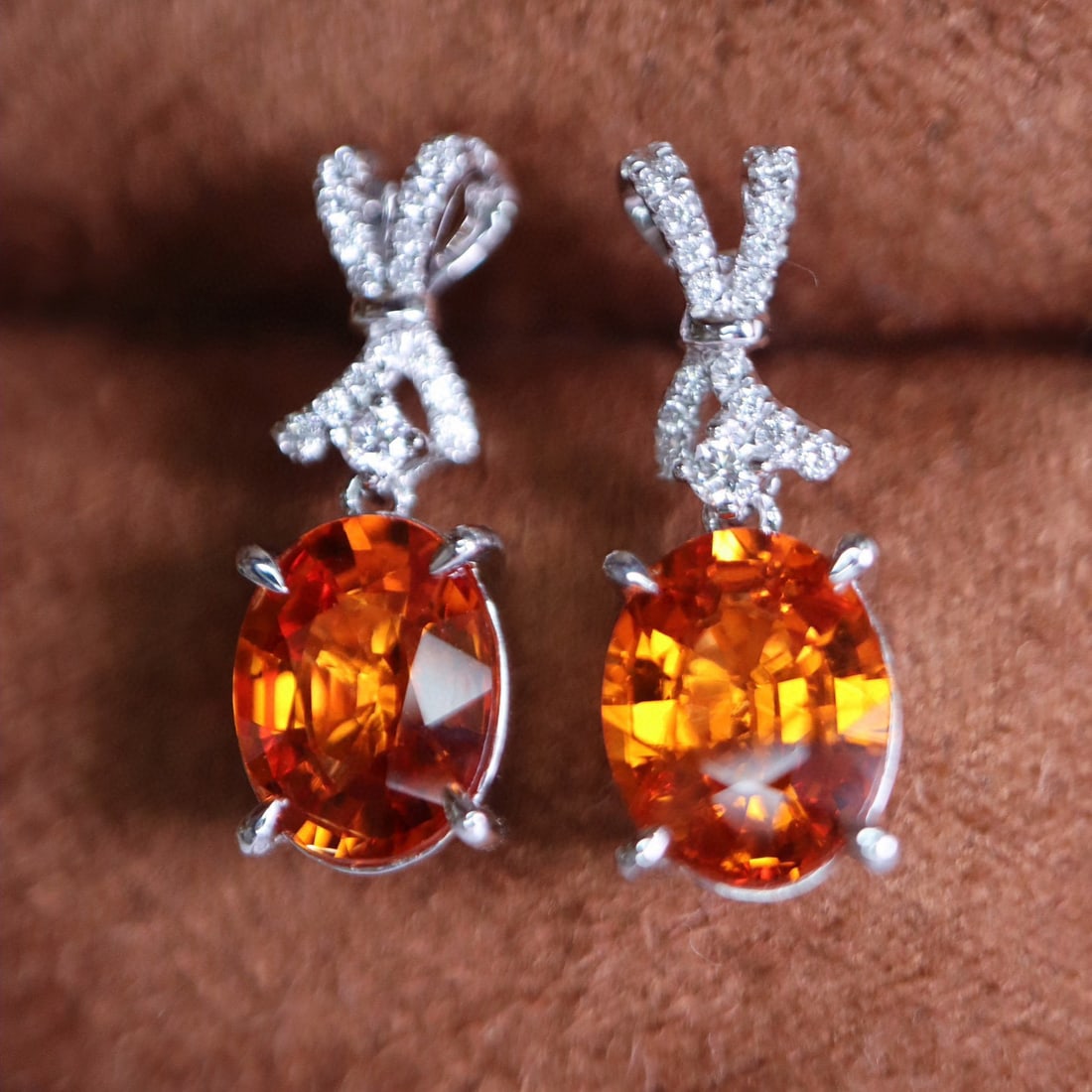 14k Gold 4.4 Ct Natural Spessartine & Diamond Earrings: Ref:230985171 // gold content:14k gold // main gemstone:spessartine // shape:oval // carat weight:4. 4ct // color:orange // treatment:natural // // adjacent gemstone 2 : diamond // shape:round // clar