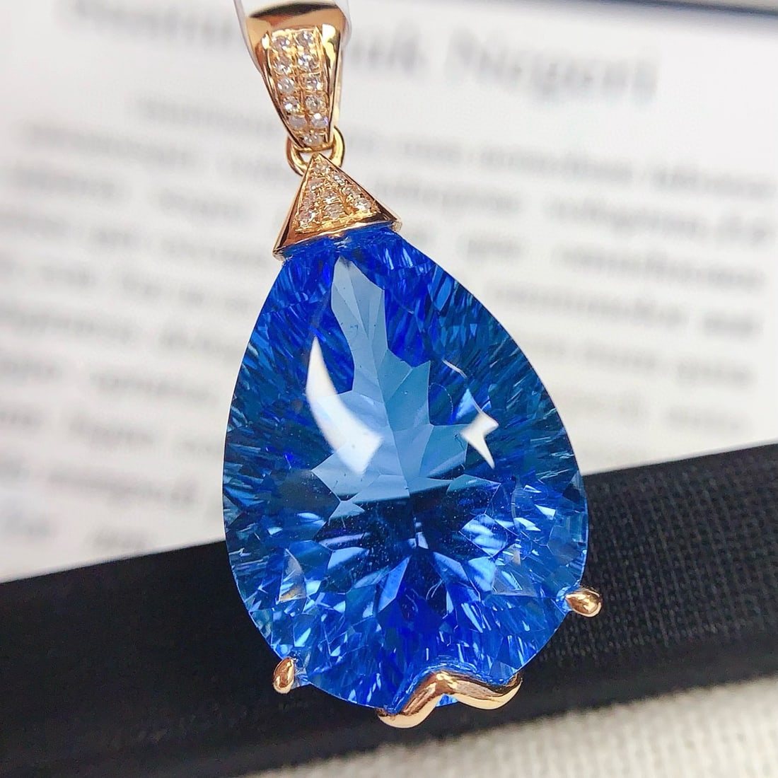 14k Gold 24.25 Ct Natural Topaz & Diamond Pendant( Without Chain ): Ref:230985202 // gold content:14k gold // main gemstone:topaz // shape:pear // carat weight:24. 25ct // color:blue // treatment:natural // // adjacent gemstone 2 : diamond // number of stones:20 //