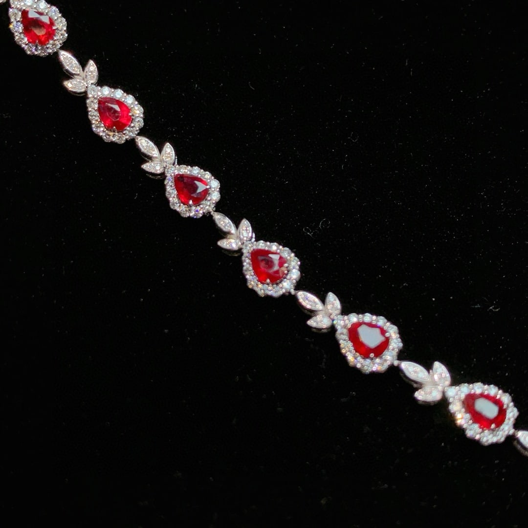14k Gold 5.08 Ctw Natural Ruby & Diamond Bracelet: Ref:230985204 // gold content:14k gold // main gemstone:ruby // shape:pear // carat weight:3. 62ct // color:red // treatment:natural // // adjacent gemstone 2 : diamond // shape:round // carat weight: