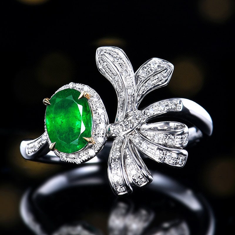 14k Gold 0.78 Ctw Vivid Green Natural Emerald & Diamond Ring: Ref:230986029 // gold content:14k gold // ring size:7. 25us // // main gemstone:emerald // shape:oval // carat weight:0. 65ct // color:vivid green // treatment:natural // // adjacent gemstone 2 :