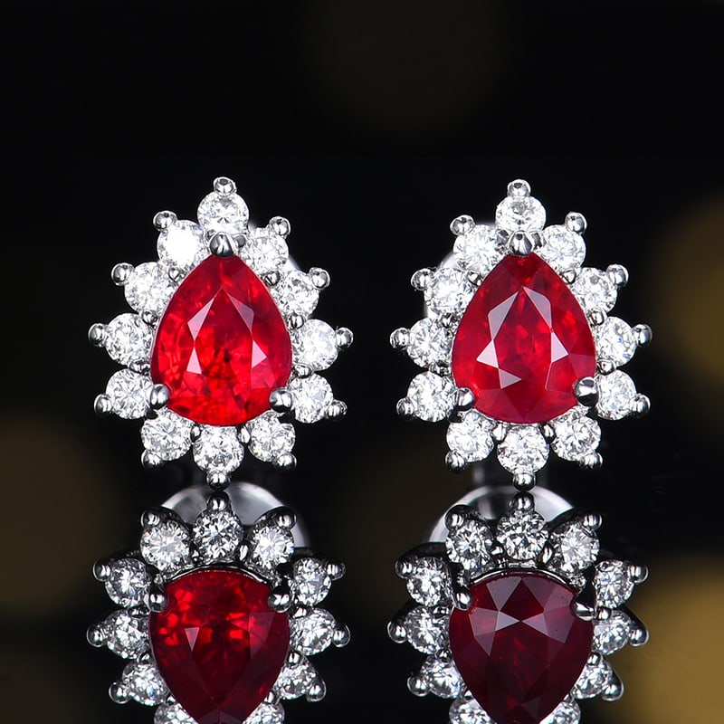 14k Gold 0.87 Ctw Natural Ruby & Diamond Earrings: Ref:230986041 // gold content:14k gold // main gemstone:ruby // shape:pear // carat weight:0. 63ct // color:pigeonblood red // treatment:natural // // adjacent gemstone 2 : diamond // number of