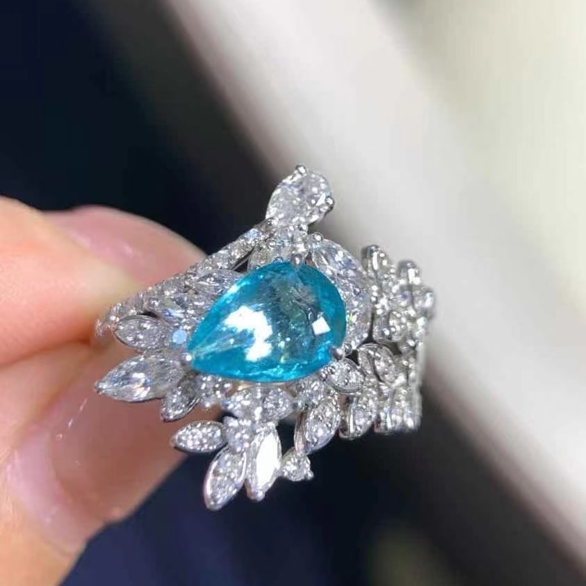 14k Gold 2.09 Ctw Natural Paraiba Tourmaline & Diamond Ring: Ref:230986084 // gold content:14k gold // ring size:7. 25us // // main gemstone:paraiba tourmaline // shape:pear // carat weight:1. 16ct // color:blue // treatment:natural // // adjacent gemstone 2 :