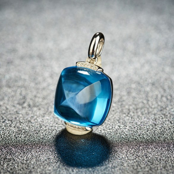 14k Gold 22 Ct Natural Topaz & Diamond Pendant( Without Chain ): Ref:230986128 // gold content:14k gold // main gemstone:topaz // shape:suger-loaf // carat weight:22ct // color:blue // treatment:natural // // adjacent gemstone 2 : diamond // shape:round // clarity