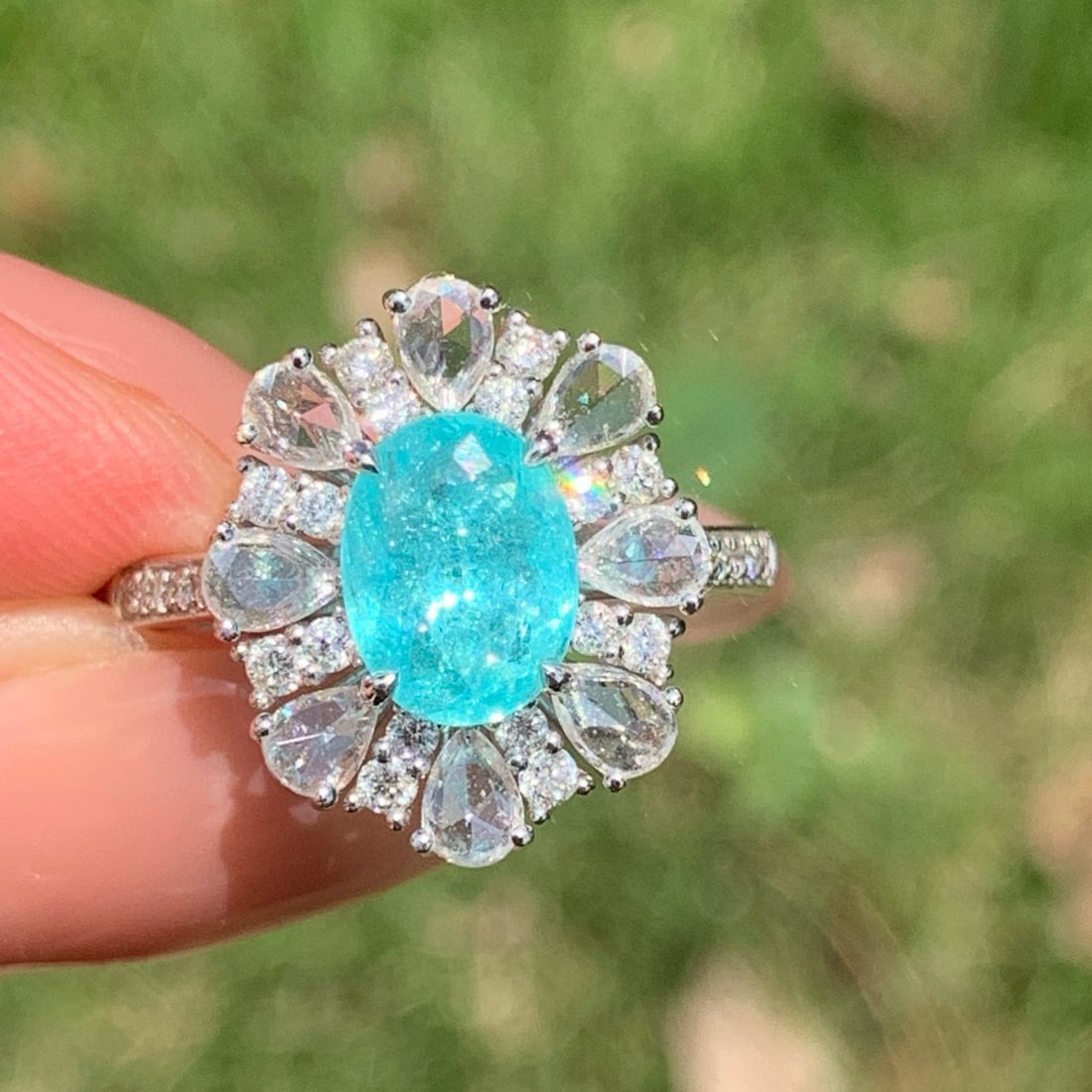 14k Gold 2.40 Ctw Natural Paraiba Tourmaline & Diamond Ring: Ref:230986149 // gold content:14k gold // ring size:7. 25us // // main gemstone:paraiba tourmaline // shape:oval // carat weight:1. 48ct // color:blue // treatment:natural // // adjacent gemstone 2 :