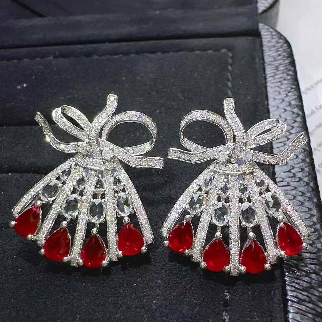 14k Gold 3.91 Ctw Natural Ruby & Diamond Earrings: Ref:230986240 // gold content:14k gold // main gemstone:ruby // shape:pear // carat weight:2. 85ct // color:pigeonblood red // treatment:natural // // adjacent gemstone 2 : diamond // shape:multiply /