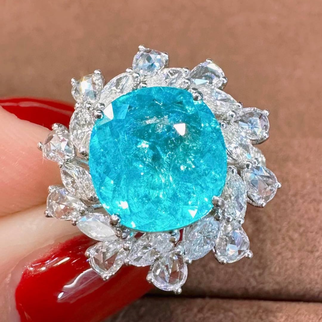 14k Gold 4.03 Ctw Natural Paraiba Tourmaline & Diamond Ring: Ref:230986301 // gold content:14k gold // ring size:7. 25us // // main gemstone:paraiba tourmaline // shape:oval // carat weight:2. 88ct // color:blue // treatment:natural // // adjacent gemstone 2 :