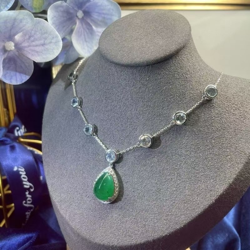 14k Gold 12.15 Ctw Natural Emerald & Topaz Necklace: Ref:230986397 // gold content:14k gold // main gemstone:emerald // shape:pear // carat weight:7. 30ct // color:green // treatment:natural // // adjacent gemstone 2 : topaz // shape:round // carat