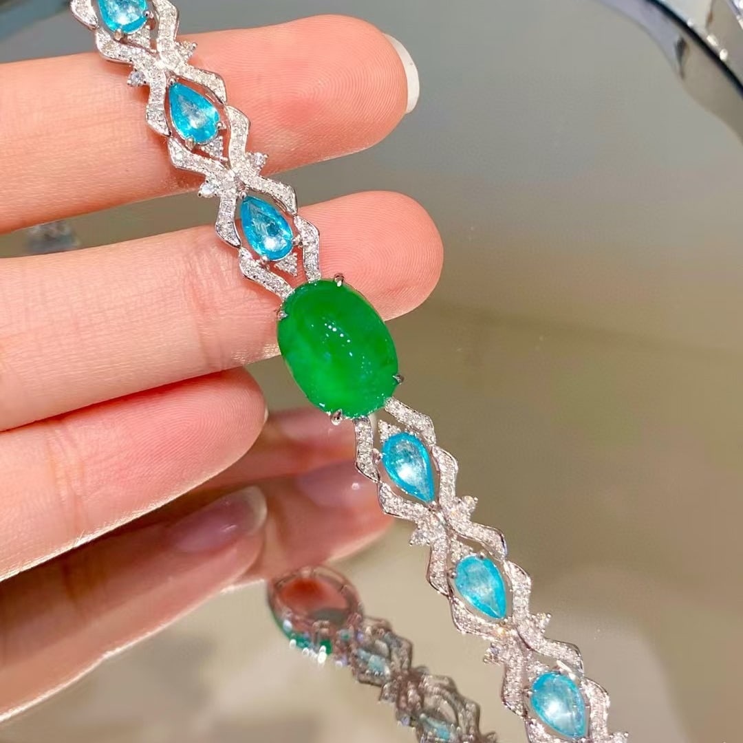 14k Gold 9.1 Ctw Vivid Green Natural Emerald & Paraiba Tourmaline Bracelet: Ref:230986404 // gold content:14k gold // main gemstone:emerald // shape:oval // carat weight:5. 6ct // color:vivid green // treatment:natural // // adjacent gemstone 2 : paraiba tourmaline //