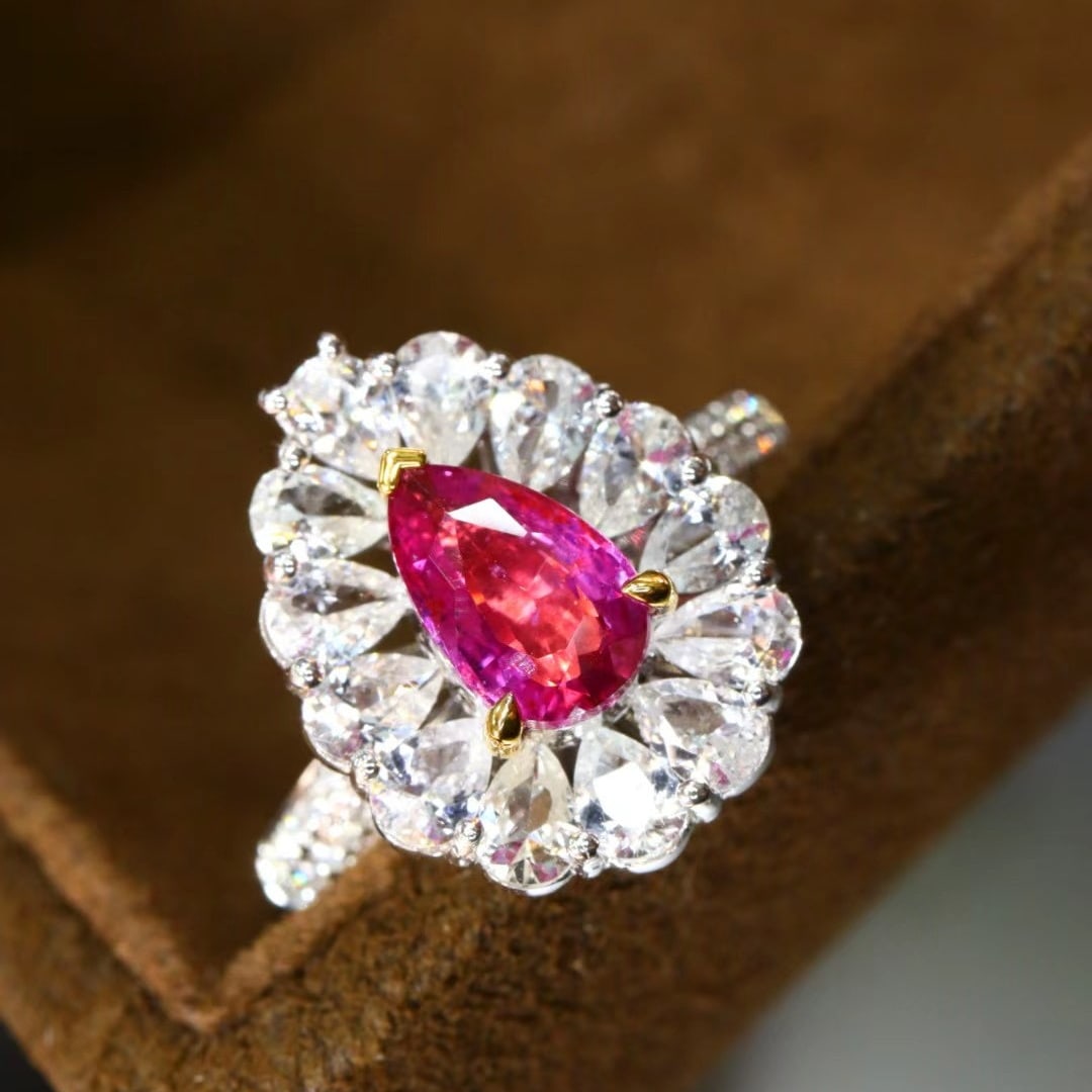 14k Gold 1.10 Ctw Natural Padparadscha Sapphire & Diamond Ring: Ref:230986449 // gold content:14k gold // ring size:7. 25us // // main gemstone:padparadscha sapphire // shape:pear // carat weight:1. 01ct // color:orangish pink // treatment:natural // // adjacent g