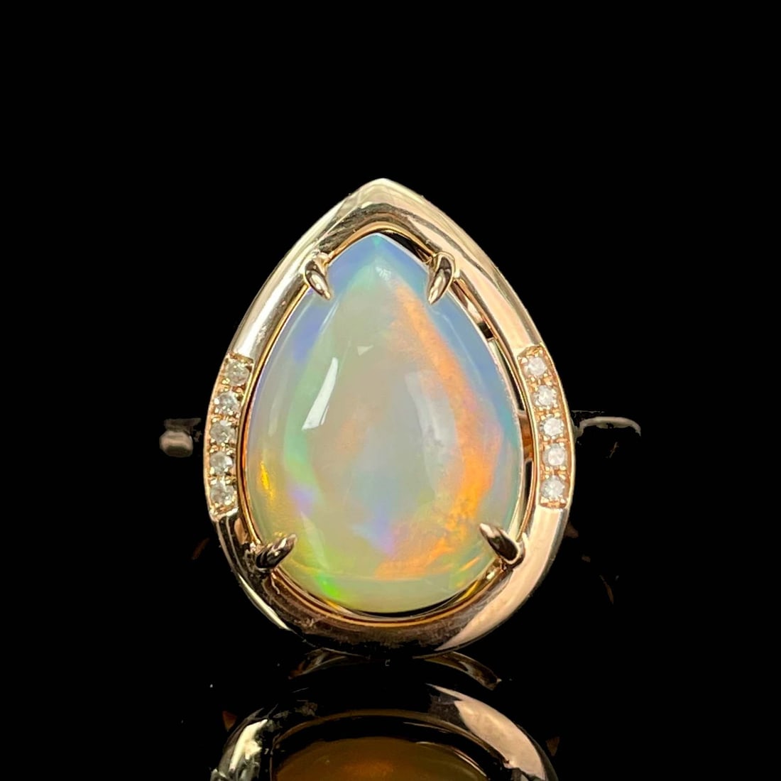 14k Gold 2.6 Ct Natural Opal & Diamond Ring: Ref:230987009 // gold content:14k gold // ring size:7. 25us // // main gemstone:opal // shape:pear // carat weight:2. 6ct // color:white // treatment:natural // cut grade:g // // adjacent gemstone 2