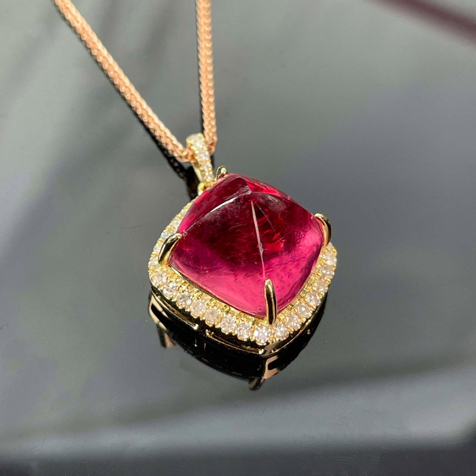 14k Gold 11.13 Ctw Natural Tourmaline & Diamond Pendant( Without Chain ): Ref:230987026 // gold content:14k gold // main gemstone:tourmaline // number of stones:1 // shape:suger-loaf // carat weight:10. 8ct // color:red // treatment:natural // cut grade:g // // adjacent gem