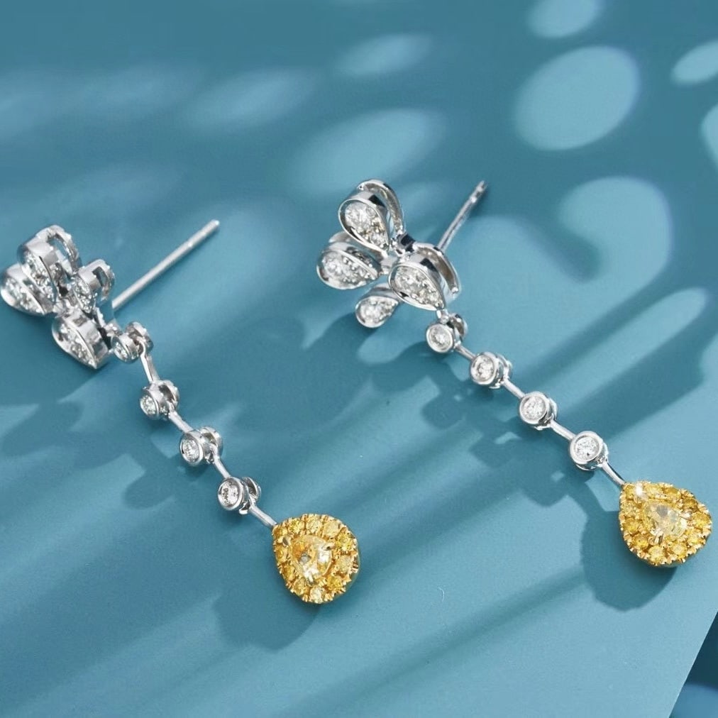 14k Gold 0.70 Ctw Natural Yellow Diamond & Diamond Earrings: Ref:230987090 // gold content:14k gold // main gemstone:yellow diamond // shape:pear // carat weight:0. 28ct // clarity grade:vs-si // color:yellow // treatment:natural // cut grade:g // // adjacent