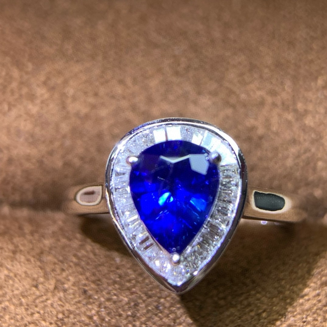 14k Gold 1.55 Ctw Natural Sapphire & Diamond Ring: Ref:230987173 // gold content:14k gold // ring size:7. 25us // // main gemstone:sapphire // shape:pear // carat weight:1. 35ct // color:blue // treatment:natural // cut grade:g // // adjacent
