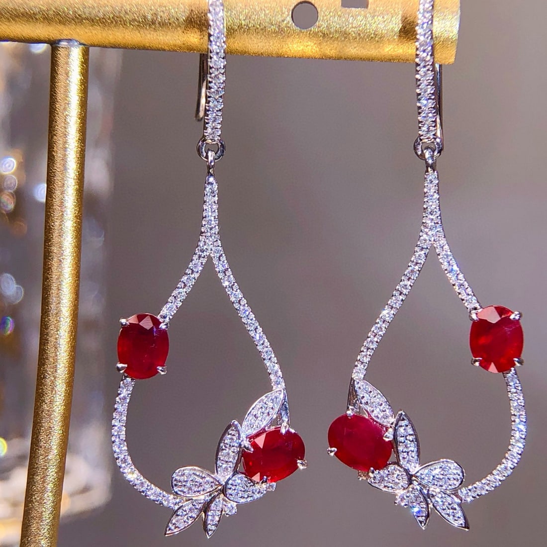 14k Gold 2.01 Ctw Natural Ruby & Diamond Earrings: Ref:230987209 // gold content:14k gold // main gemstone:ruby // shape:oval // carat weight:1. 62ct // color:red // treatment:natural // cut grade:g // // adjacent gemstone 2 : diamond // shape:round