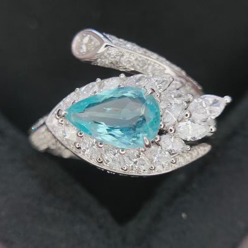 14k Gold 2.27 Ctw Natural Paraiba Tourmaline & Diamond Ring: Ref:230988040 // gold content:14k gold // ring size:7. 25us // // main gemstone:paraiba tourmaline // shape:pear // carat weight:1. 06ct // color:blue // treatment:natural // // adjacent gemstone 2 : 