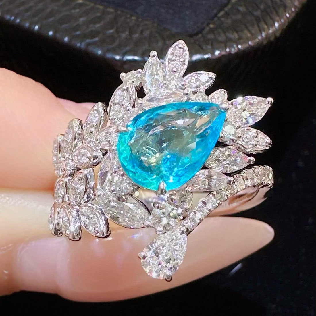 14k Gold 2.09 Ctw Natural Paraiba Tourmaline & Diamond Ring: Ref:230988043 // gold content:14k gold // ring size:7. 25us // // main gemstone:paraiba tourmaline // shape:pear // carat weight:1. 16ct // color:blue // treatment:natural // // adjacent gemstone 2 : 