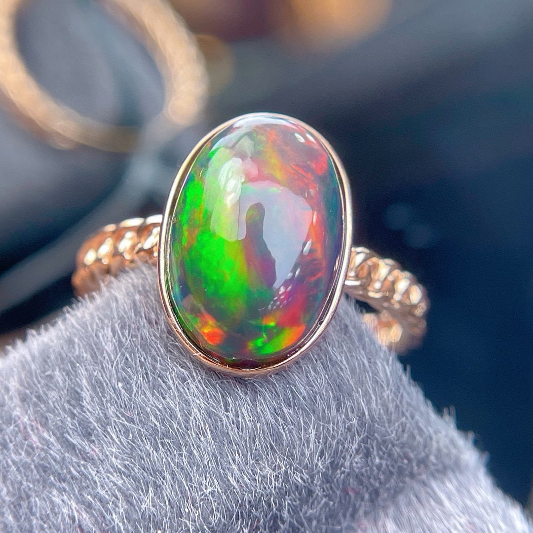 14k Gold 3.7 Ct Natural Opal Ring: Ref:230988111 // gold content:14k gold // ring size:7. 25us // // main gemstone:opal // shape:oval // carat weight:3. 7ct // color:color // treatment:natural // Condition: New High Estimate: 2600 Low