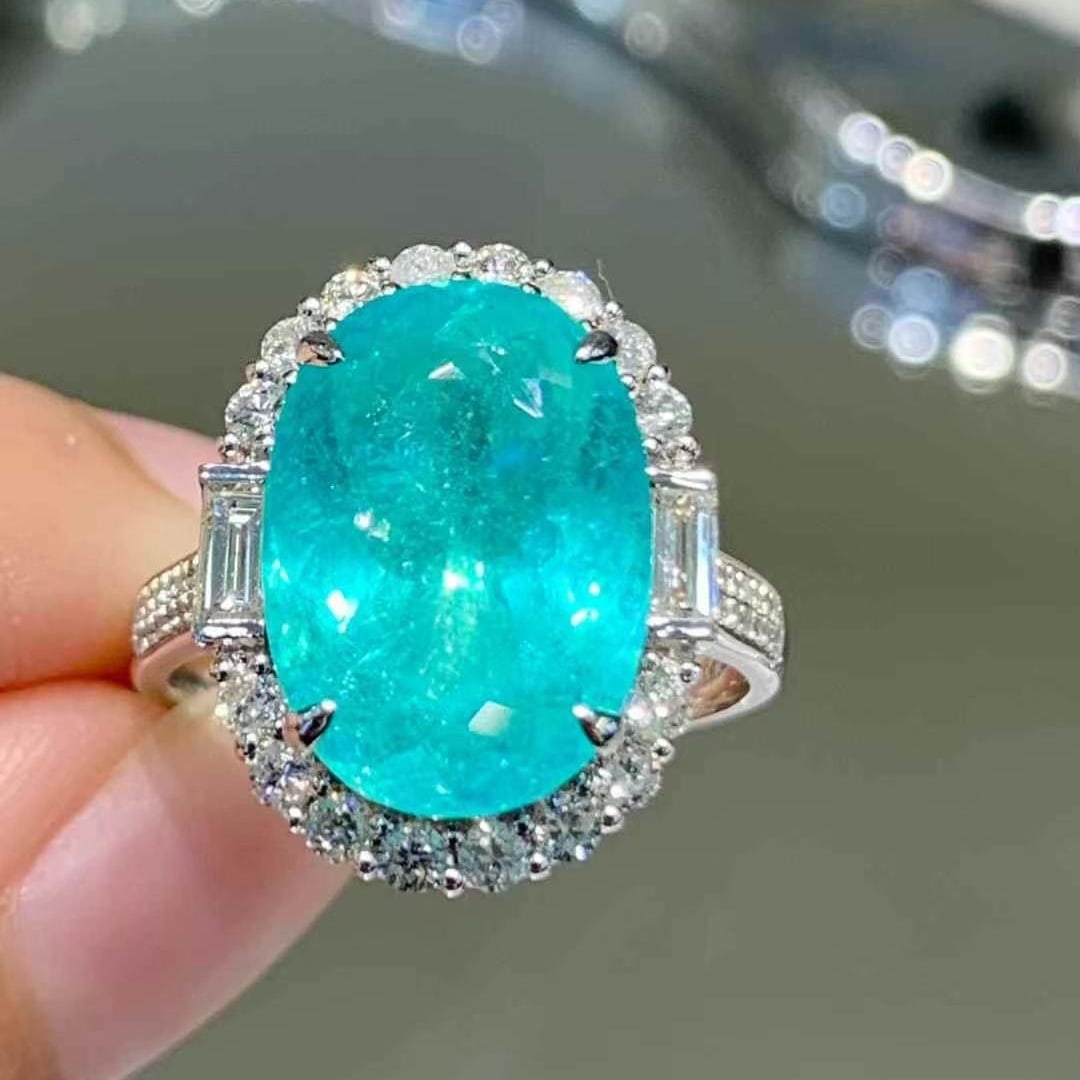 14k Gold 6.5 Ct Natural Paraiba Tourmaline & Diamond Ring: Ref:230988159 // gold content:14k gold // ring size:7. 25us // // main gemstone:paraiba tourmaline // shape:oval // carat weight:6. 5ct // color:blue // treatment:natural // // adjacent gemstone 2 : d