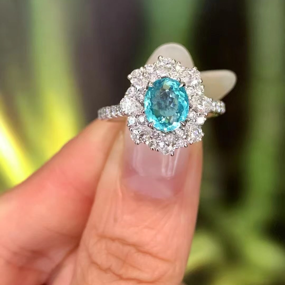 14k Gold 2.30 Ctw Natural Paraiba Tourmaline & Diamond Ring: Ref:230988239 // gold content:14k gold // ring size:7. 25us // // main gemstone:paraiba tourmaline // shape:oval // carat weight:1. 26ct // color:blue // treatment:natural // // adjacent gemstone 2 :