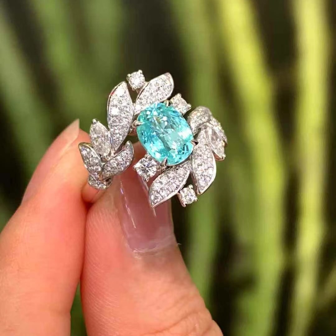 14k Gold 2.01 Ctw Natural Paraiba Tourmaline & Diamond Ring: Ref:230988240 // gold content:14k gold // ring size:7. 25us // // main gemstone:paraiba tourmaline // shape:oval // carat weight:1. 31ct // color:blue // treatment:natural // // adjacent gemstone 2 : 