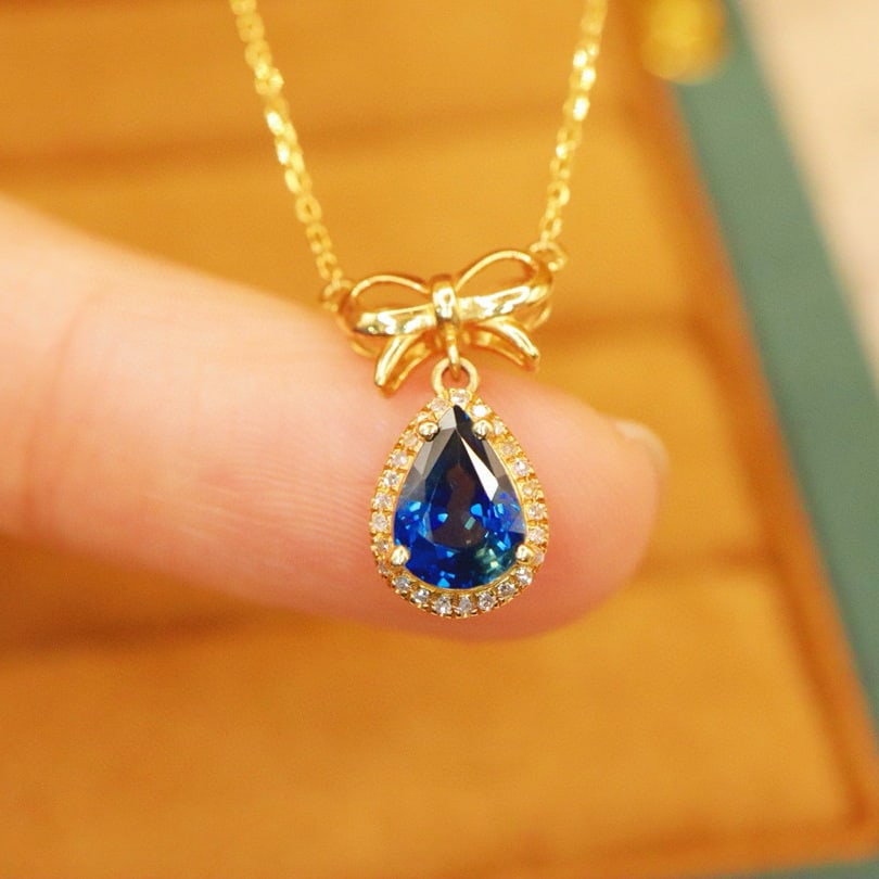 14k Gold 1.0 Ct Natural Sapphire & Diamond Necklace: Ref:230988337 // gold content:14k gold // main gemstone:sapphire // shape:pear // carat weight:1. 0ct // color:blue // treatment:natural // // adjacent gemstone 2 : diamond // number of stones:25 //