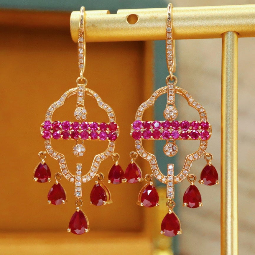 14k Gold 3.22 Ctw Natural Ruby & Ruby Earrings: Ref:230988344 // gold content:14k gold // main gemstone:ruby // shape:pear // carat weight:2. 38ct // color:pigeonblood red // treatment:natural // // adjacent gemstone 2 : ruby // shape:round //