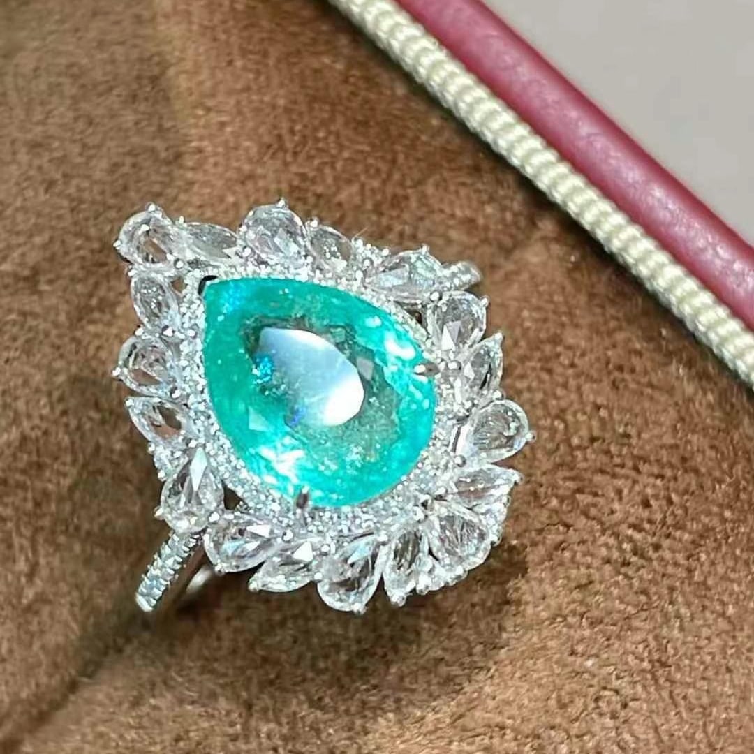 14k Gold 2.27 Ct Natural Paraiba Tourmaline & Sapphire & Diamond Ring: Ref:230988348 // gold content:14k gold // ring size:7. 25us // // main gemstone:paraiba tourmaline // shape:pear // carat weight:2. 27ct // color:bluish green // treatment:natural // // adjacent