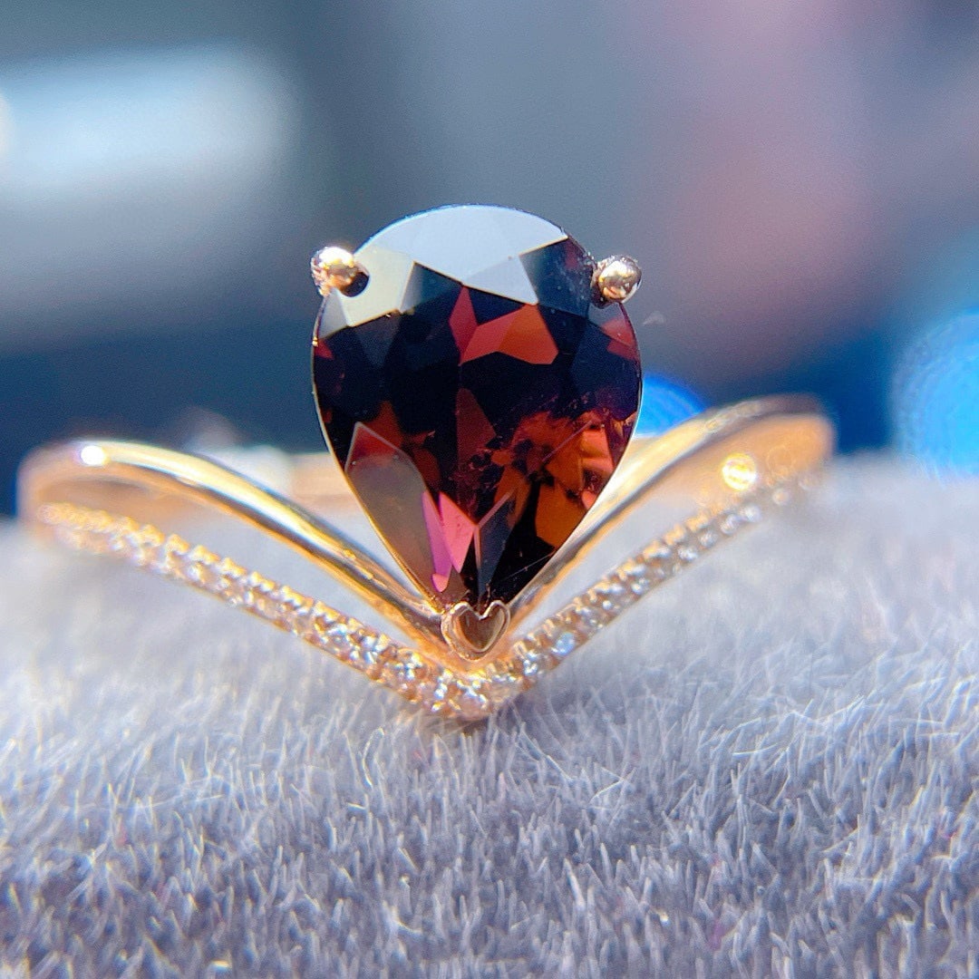 14k Gold 2.1 Ct Natural Tourmaline & Diamond Ring: Ref:230988379 // gold content:14k gold // ring size:7. 25us // // main gemstone:tourmaline // shape:pear // carat weight:2. 1ct // color:red // treatment:natural // // adjacent gemstone 2 : diamond