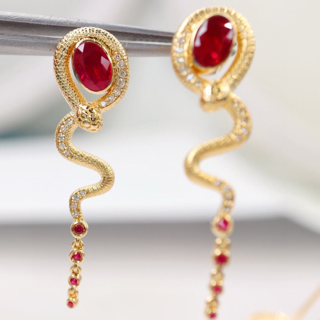 14k Gold 1.48 Ctw Natural Ruby & Diamond Earrings: Ref:230991002 // gold content:14k gold // main gemstone:ruby // shape:oval // carat weight:1. 35ct // color:red // treatment:natural // // adjacent gemstone 2 : diamond // shape:round // carat