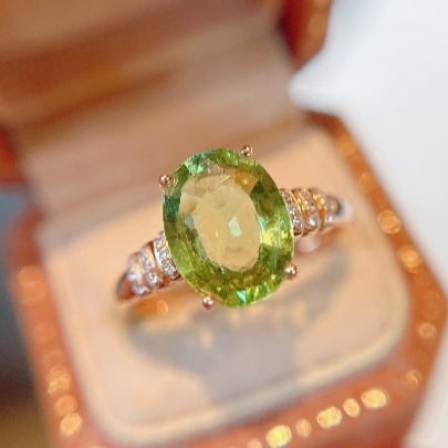 14k Gold 2.11 Ct Natural Tourmaline & Diamond Ring: Ref:230991178 // gold content:14k gold // ring size:7. 25us // // main gemstone:tourmaline // shape:oval // carat weight:2. 11ct // color:green // treatment:natural // // adjacent gemstone 2 : diamond