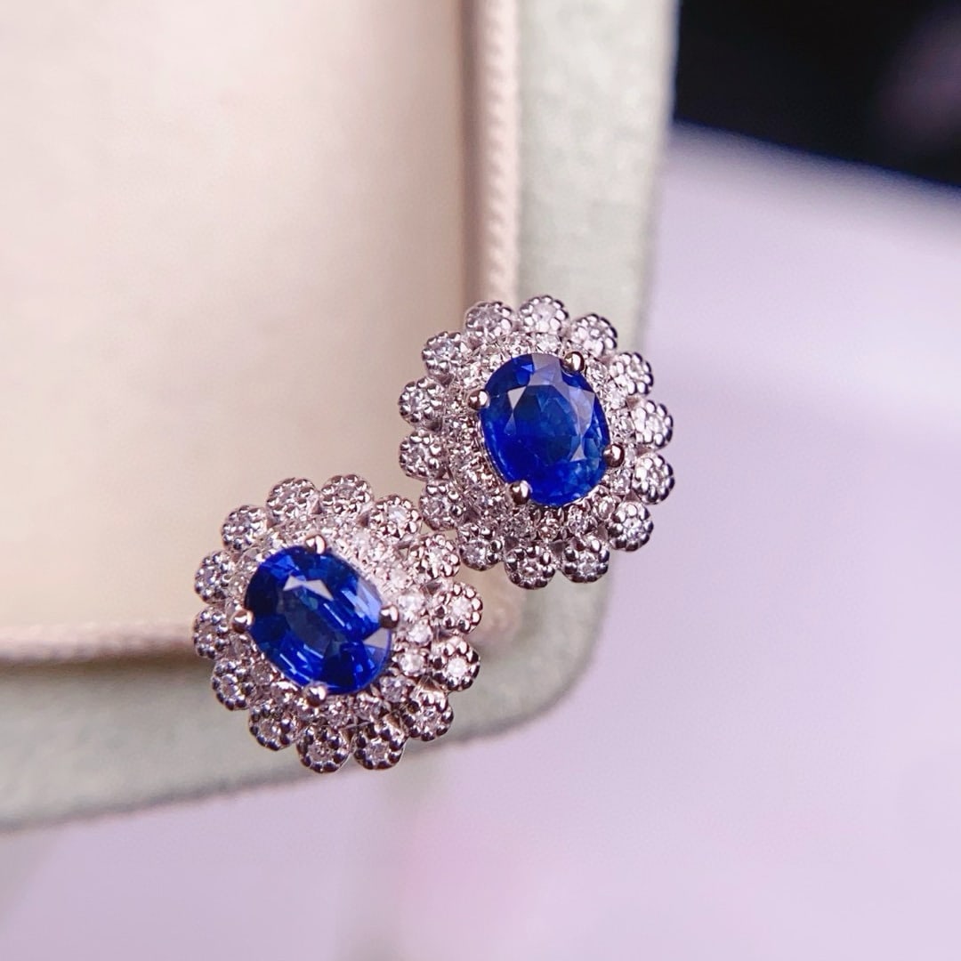 14k Gold 1.3 Ct Natural Sapphire & Diamond Earrings: Ref:230991189 // gold content:14k gold // main gemstone:sapphire // shape:oval // carat weight:1. 3ct // color:blue // treatment:natural // // adjacent gemstone 2 : diamond // number of stones:66 //