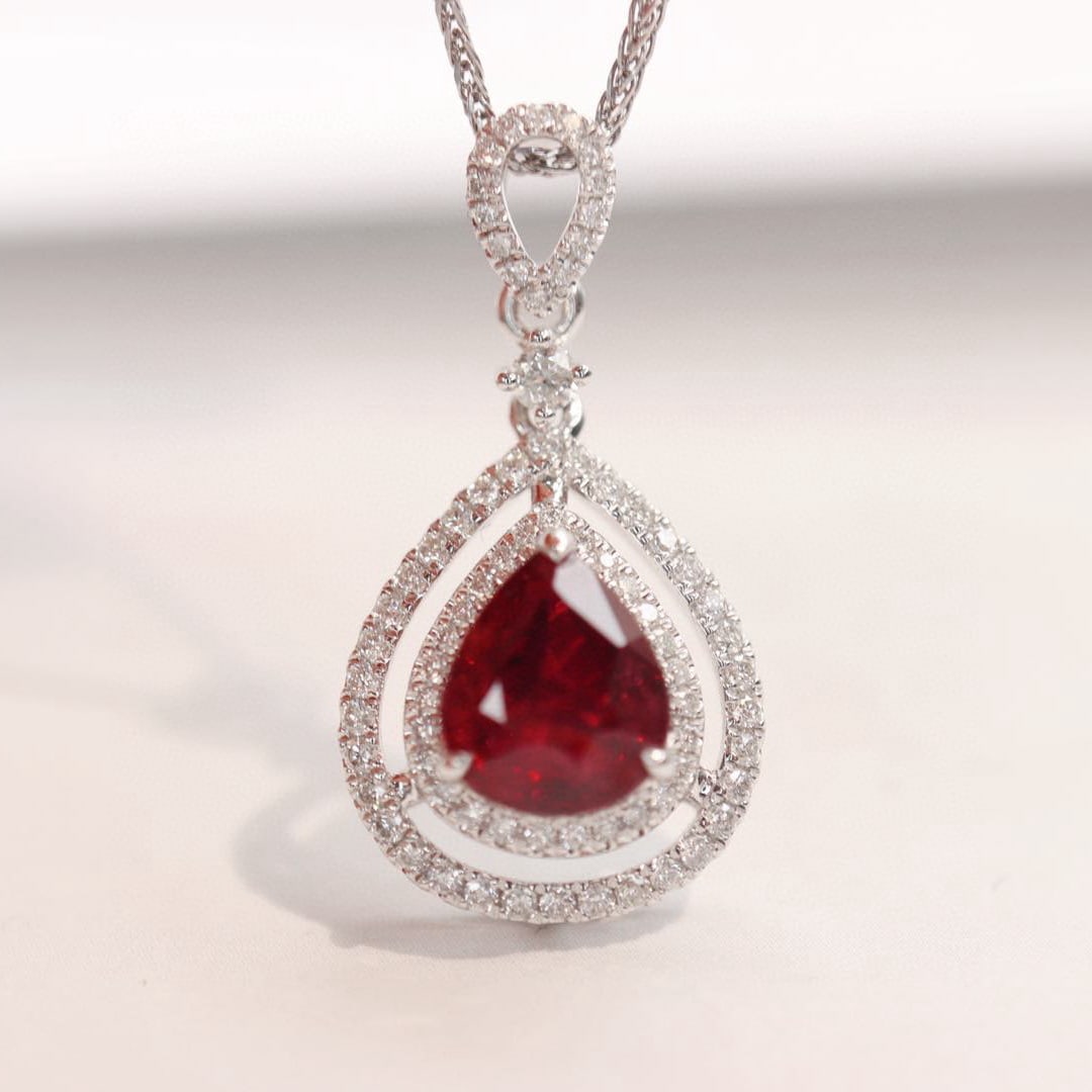 14k Gold 1.86 Ctw Vivid Red Natural Ruby & Diamond Pendant( Without Chain ): Ref:230991190 // gold content:14k gold // main gemstone:ruby // shape:pear // carat weight:1. 55ct // color:vivid red // treatment:natural // // adjacent gemstone 2 : diamond // shape:round // carat