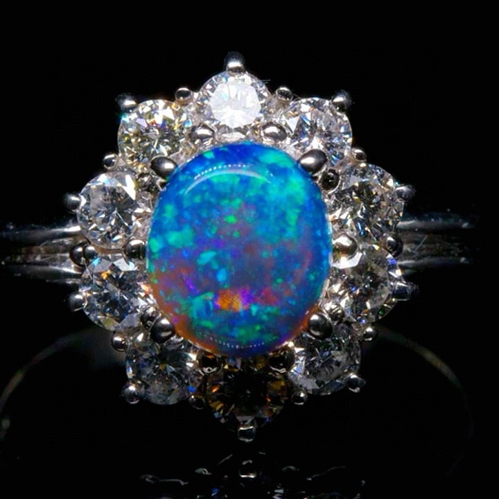 14k Gold 1.81 Ctw Natural Opal & Diamond Ring: Ref:230992105 // gold content:14k gold // ring size:7. 25us // // main gemstone:opal // shape:oval // carat weight:1. 06ct // color:color // treatment:natural // // adjacent gemstone 2 : diamond // sh
