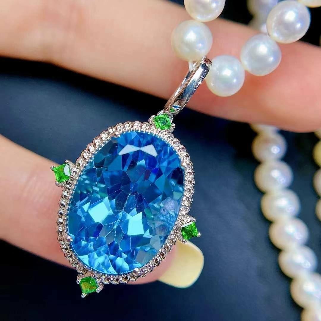 14k Gold 20 Ct Natural Topaz & Emerald Pendant( Without Chain ): Ref:230992142 // gold content:14k gold // main gemstone:topaz // shape:oval // carat weight:20ct // color:blue // treatment:natural // // adjacent gemstone 2 : emerald // number of stones:4 // shape:s