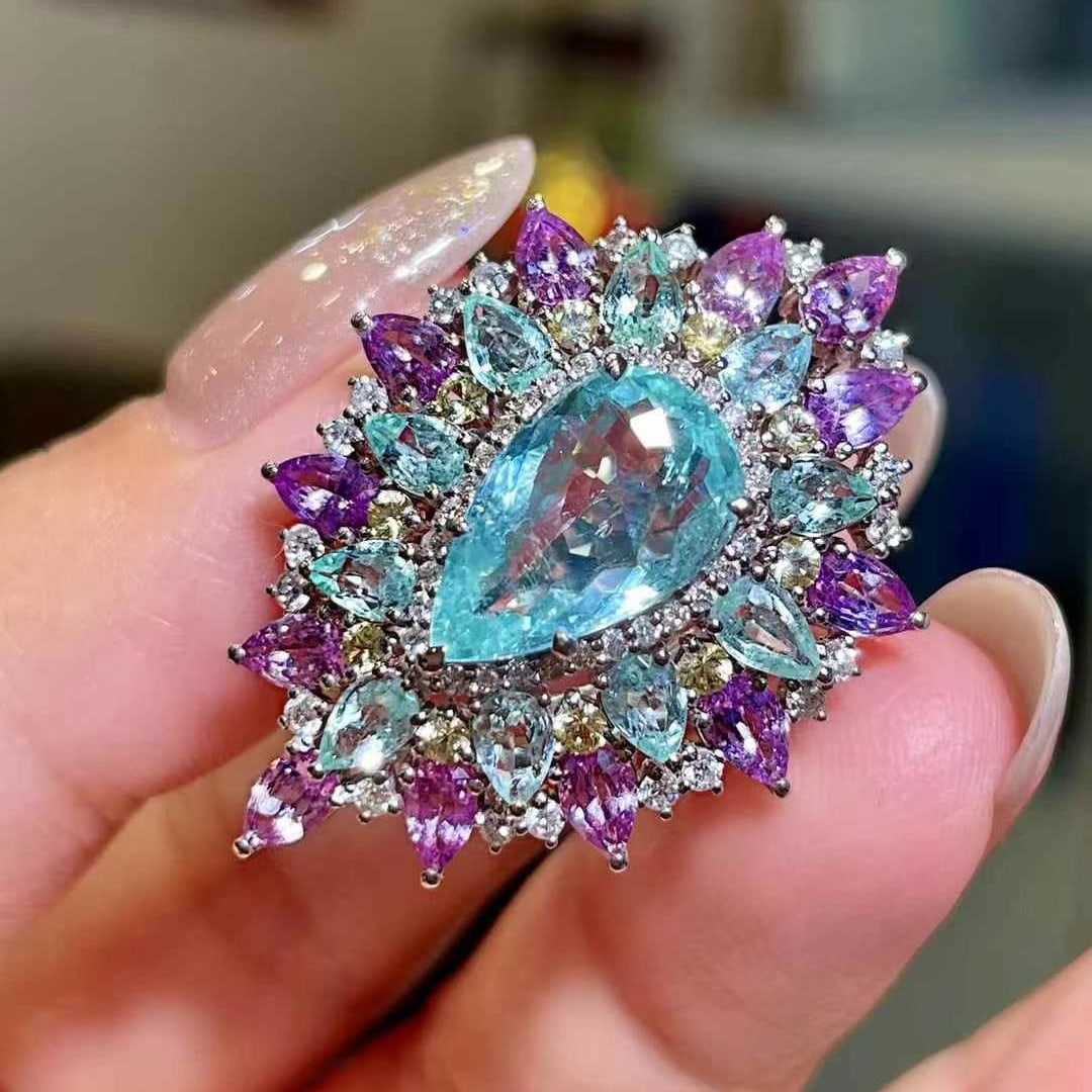 14k Gold 3.33 Ctw Natural Paraiba Tourmaline & Diamond Ring: Ref:230992165 // gold content:14k gold // ring size:7. 25us // // main gemstone:paraiba tourmaline // shape:pear // carat weight:2. 85ct // color:blue // treatment:natural // // adjacent gemstone 2 : 